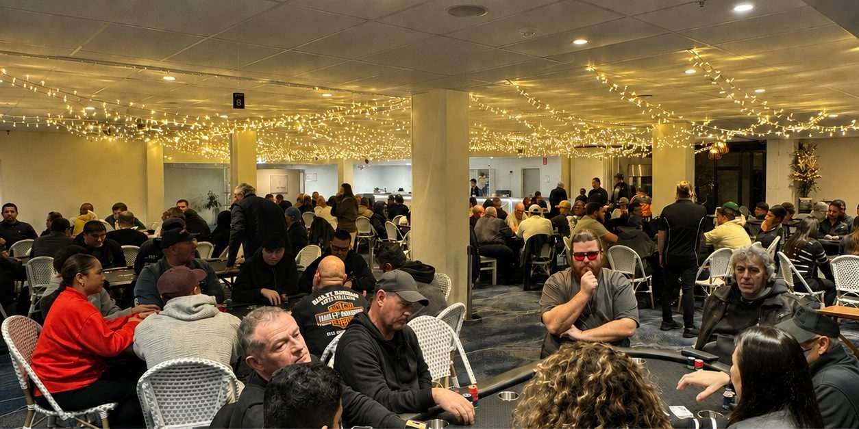 A packed 124 Poker series event with tables running across the whole room under fairy lights